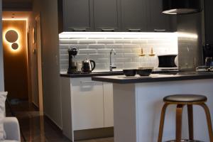 Kuchyň nebo kuchyňský kout v ubytování Comely luxury Apt Must