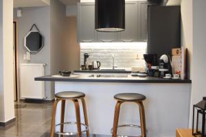 Kuchyň nebo kuchyňský kout v ubytování Comely luxury Apt Must