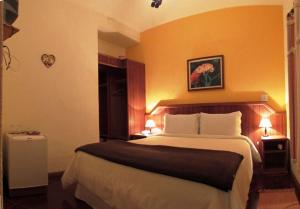 Posteľ alebo postele v izbe v ubytovaní Cheiro de Mata Pousada e Restaurante Ltda