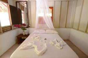 Postel nebo postele na pokoji v ubytování Isla Grande Eco-Hostal