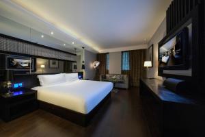 Rúm í herbergi á Crystal Orange Hotel Shanghai Kangqiao Branch