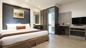 מיטה או מיטות בחדר ב-The Key Bangkok Hotel