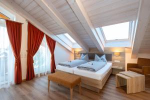 Postel nebo postele na pokoji v ubytování Boutique Hotel Angerer