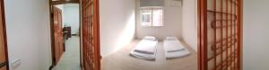 Una cama o camas en una habitación de Ta Li Wen B&B