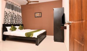 Voodi või voodid majutusasutuse Itsy Hotels Shivaas Kuteera, 450m from Narayana Multi Speciality Hospital toas