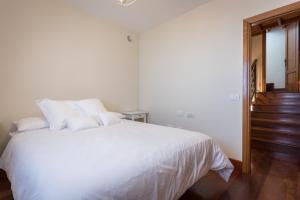 Postel nebo postele na pokoji v ubytování Villa Limonero