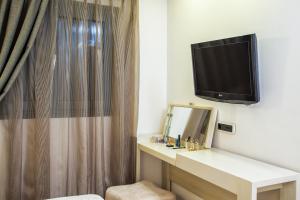 TV in/ali zabaviščno središče v nastanitvi Core Hotel