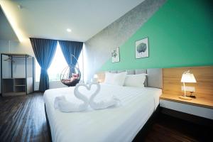Postel nebo postele na pokoji v ubytování MYe Hotel