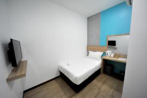 Postel nebo postele na pokoji v ubytování MYe Hotel