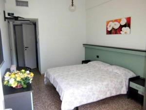Postel nebo postele na pokoji v ubytování Hotel Palm Beach