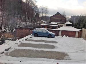 Apartmány Nad řekou v zime