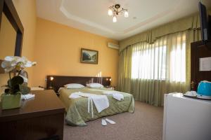 Кровать или кровати в номере Hotel Saya