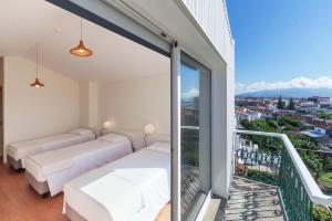 Postel nebo postele na pokoji v ubytování A Bica Hostel