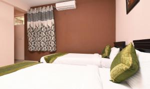 Voodi või voodid majutusasutuse Itsy Hotels Shivaas Kuteera, 450m from Narayana Multi Speciality Hospital toas