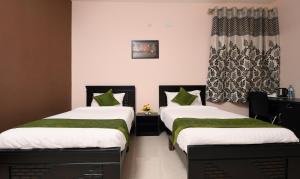 Voodi või voodid majutusasutuse Itsy Hotels Shivaas Kuteera, 450m from Narayana Multi Speciality Hospital toas