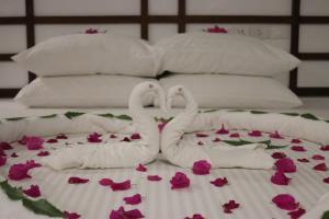 Ένα ή περισσότερα κρεβάτια σε δωμάτιο στο Madivaru Kro