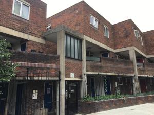 a brick building with a gate in front of it at Perfect Modern Base Near All Attractions in London