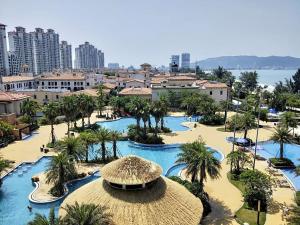 an aerial view of a resort with pools and palm trees at 晓院 Hue Garden in Huidong