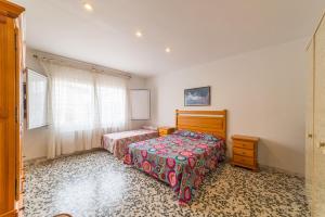 Postel nebo postele na pokoji v ubytování Villa Nuria