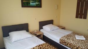 Postel nebo postele na pokoji v ubytování Zatishok Guest House