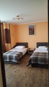 Postel nebo postele na pokoji v ubytování Zatishok Guest House