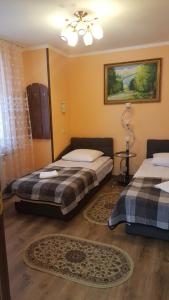 Postel nebo postele na pokoji v ubytování Zatishok Guest House