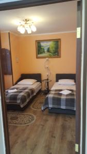 Postel nebo postele na pokoji v ubytování Zatishok Guest House