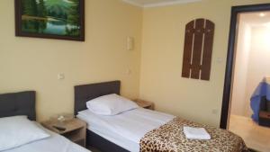 Postel nebo postele na pokoji v ubytování Zatishok Guest House