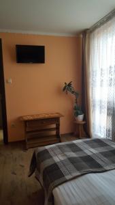 Postel nebo postele na pokoji v ubytování Zatishok Guest House
