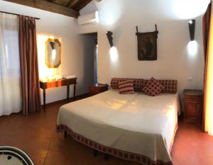 Postel nebo postele na pokoji v ubytování Resort Fonte Vulci