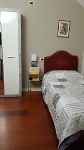 Rúm í herbergi á Ristorante Albergo Corona