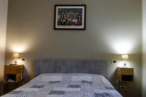 Rúm í herbergi á Ristorante Albergo Corona