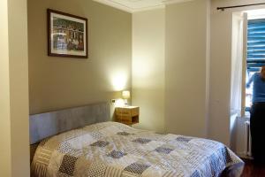 Rúm í herbergi á Ristorante Albergo Corona