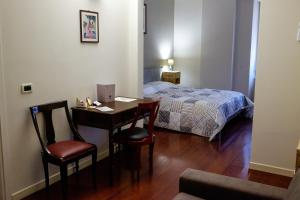 Rúm í herbergi á Ristorante Albergo Corona