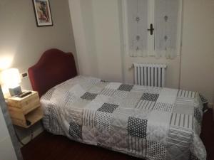 Rúm í herbergi á Ristorante Albergo Corona