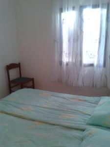 Ένα ή περισσότερα κρεβάτια σε δωμάτιο στο Apartman Romandic