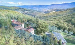 uma vista aérea de uma casa numa colina em Casignano em Bagno a Ripoli