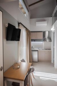 Kuchyň nebo kuchyňský kout v ubytování Stylish Studio Apartment - 8F House