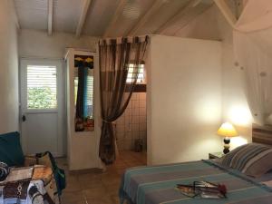 Postel nebo postele na pokoji v ubytování Villa Rose Caraibes