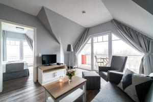 TV a/nebo společenská místnost v ubytování Strandhafer Aparthotel