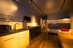 a kitchen and living room with a bunk bed at New Gudauri Loft 1 #440 in Gudauri