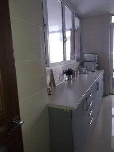 a kitchen with a counter top and a window at Sweet2sleep in Kyiv +25 photos