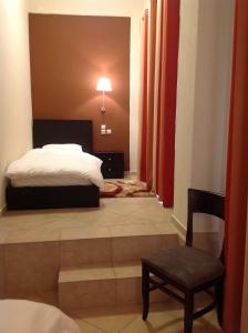 Postel nebo postele na pokoji v ubytování Hotel Meteoritis