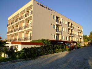 a building with a street in front of it at Albayrak Hotel in Çeşme