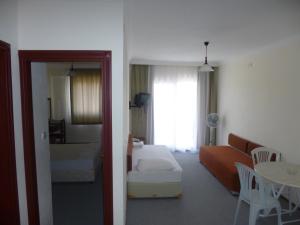 מיטה או מיטות בחדר ב-Albayrak Hotel