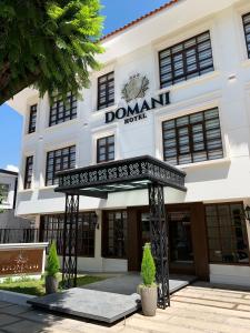 a building with a sign that reads dominant hotel at Domani Hotel Boutique in Cochabamba