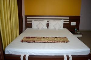 Postel nebo postele na pokoji v ubytování Blooming Star Guest House