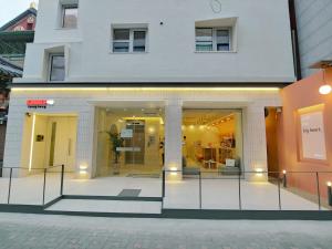 a store front with glass doors in a building at Tong Tong Petit Hotel in Seoul