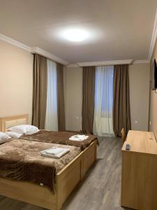 Letto o letti in una camera di Hotel Patriot