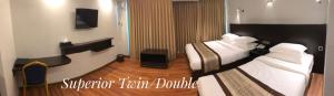 Katil atau katil-katil dalam bilik di Hotel Rose Hill